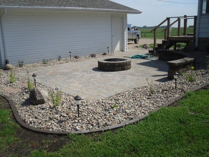 Patio Installation with rockbed surrounding